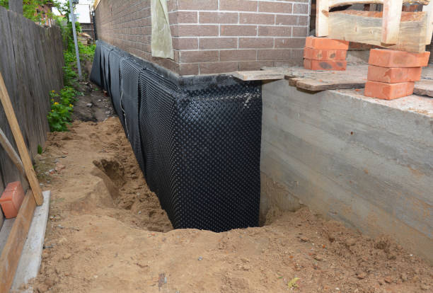Happy homeowners after waterproofing job in Hollansburg